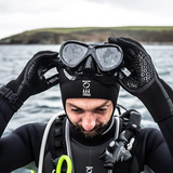 Diver wearing Fourth Element Hydrolock 3mm Neoprene dive glove