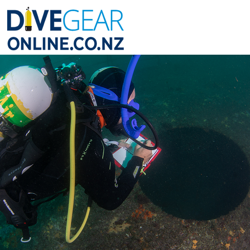 Technical diver using wet notes on a scuba dive